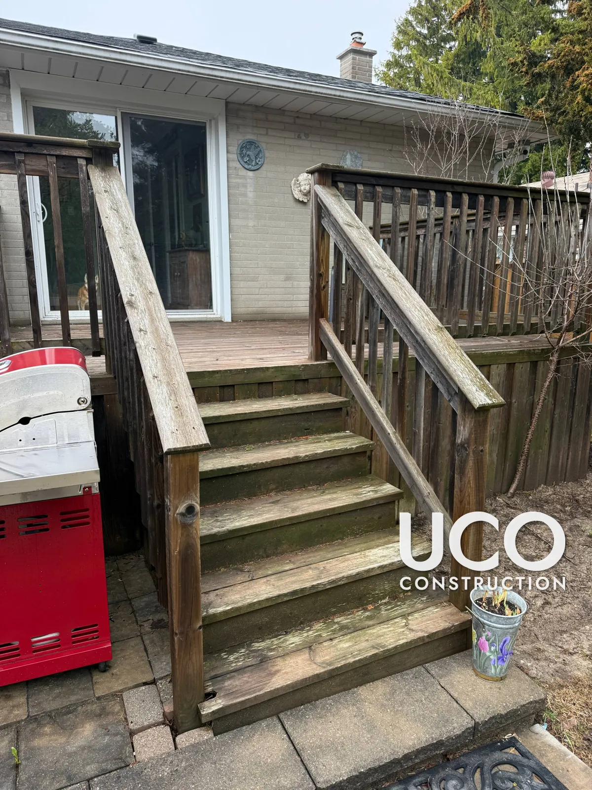 Deck Cleaning and Staining in Aurora: Grey, Mildewed Deck With Stairs, Railings and Skirting Power Washed and Refinished in a Cedar Stain