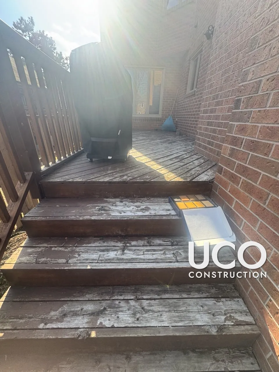 Deck Staining in East York: Two Decks With Peeling Brown Stain Sanded and Refinished Two-Tone, Cedar Deck Boards and Black Railings