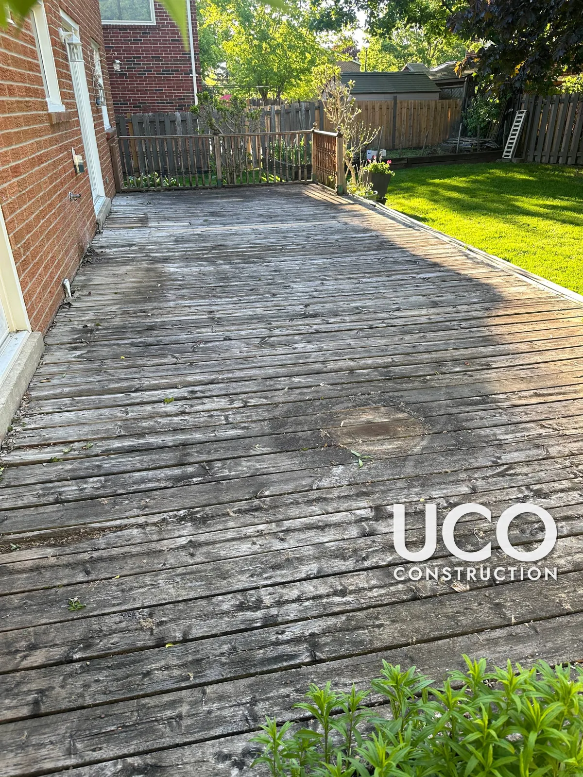 Deck Resurfacing in Newmarket: Worn Grey Deck Boards Replaced With New Pressure-Treated Decking, New Railings, Steps and Skirting