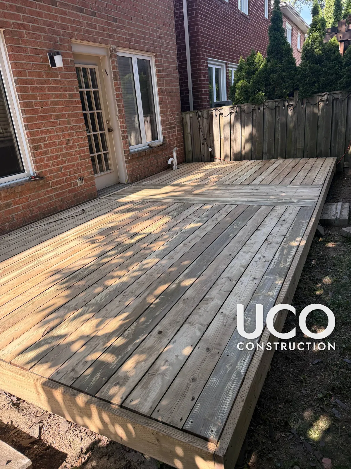 Painted Deck Restoration in Thornhill: Peeling Deck Paint Sanded Off to Bare Wood and Refinished in a Brown Deck Stain
