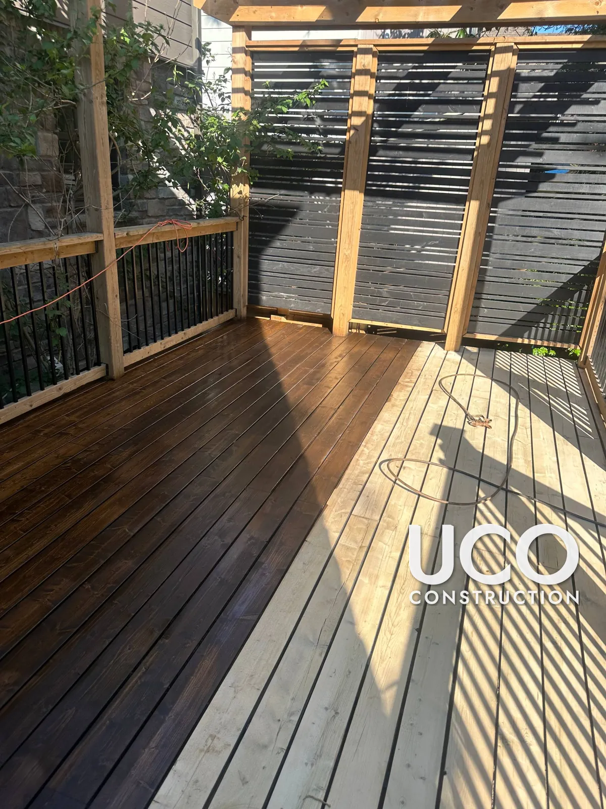 Deck Staining in Etobicoke: Peeling Dark Grey Solid Stain Sanded Off and Deck Refinished in a Rich Dark Brown Penetrating Stain