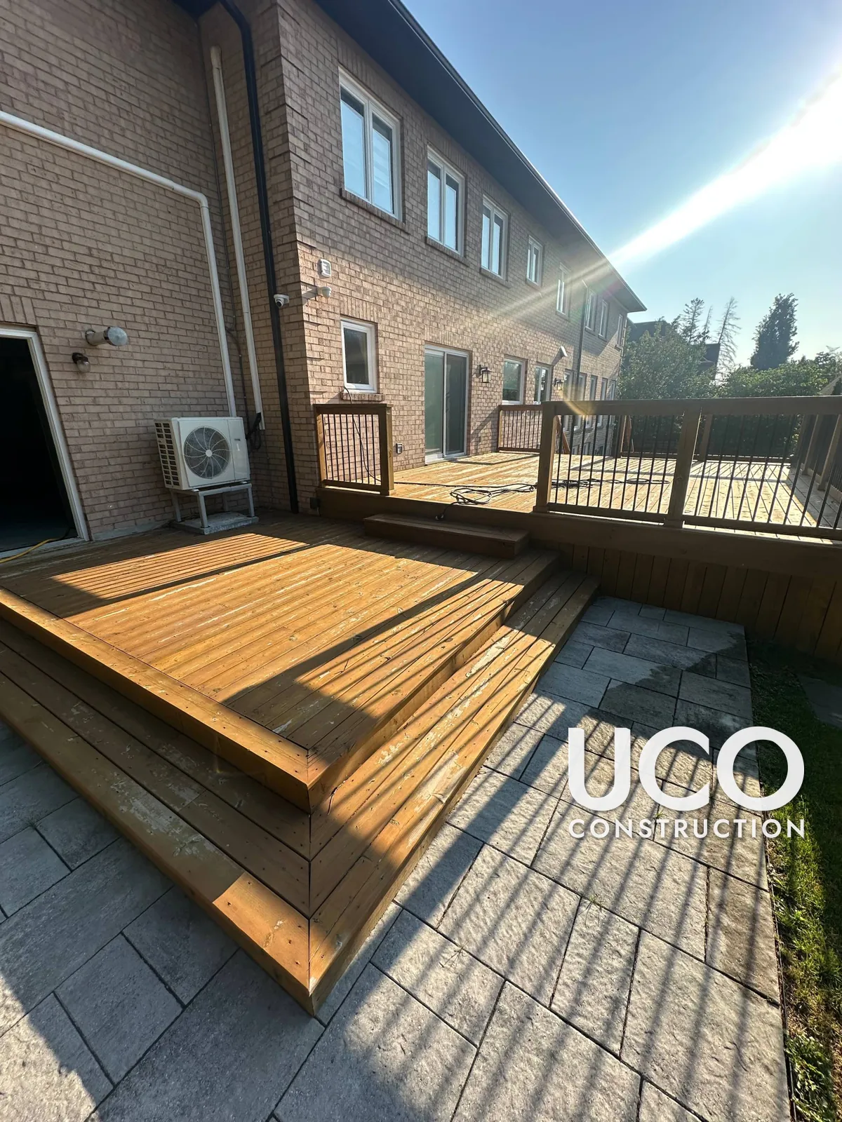 Deck Staining in Richmond Hill: Two-Level Deck With Wraparound Steps and Railings Sanded and Refinished in a Rich Cedar Stain