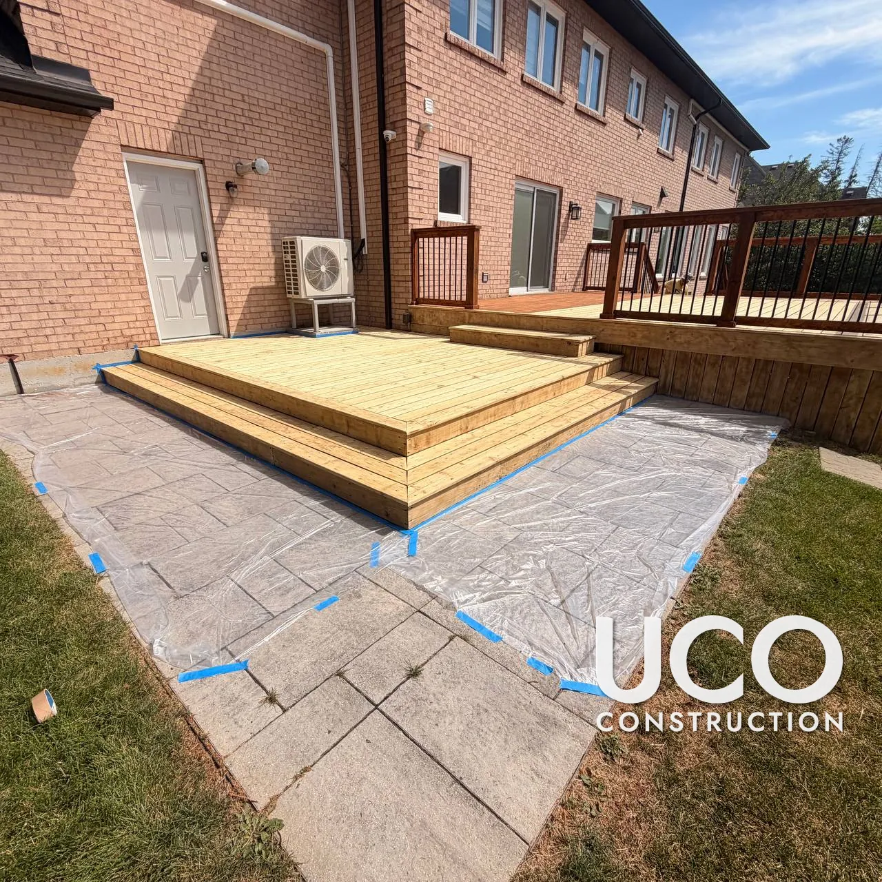 Deck Staining in Richmond Hill: Two-Level Deck With Wraparound Steps and Railings Sanded and Refinished in a Rich Cedar Stain