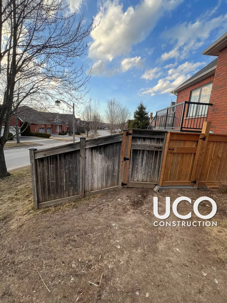 Fence Cleaning in Uxbridge: Grey, Weathered Wood Fence and Gate Restored With Wood Cleaner and Power Washing
