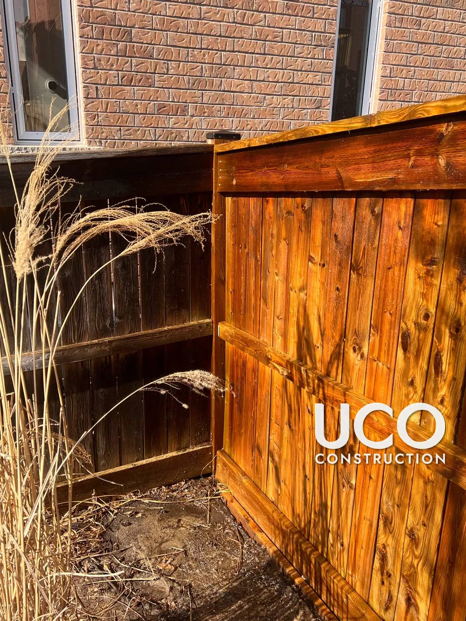 Fence Cleaning in Uxbridge: Grey, Weathered Wood Fence and Gate Restored With Wood Cleaner and Power Washing