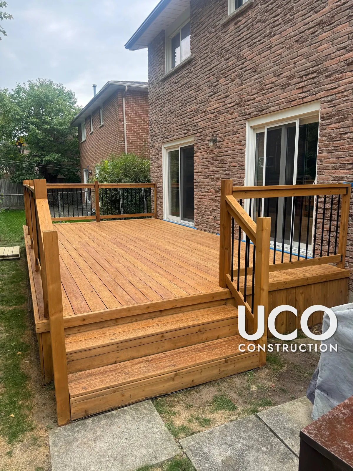 Deck Staining in Markham: Peeling Solid Stain Sanded Off a Deck, Stairs and Railings and Refinished in a Warm Cedar Stain
