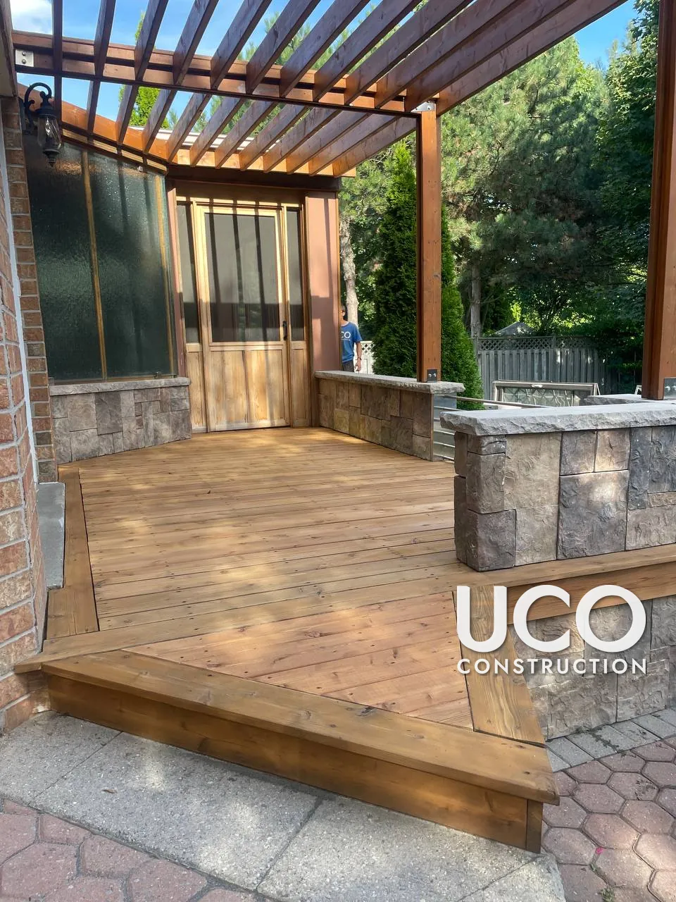 Cedar Deck and Sunroom Floor Restoration in Whitby: Weathered Cedar Boards Replaced Where Needed, Sanded and Stained Under a Pergola