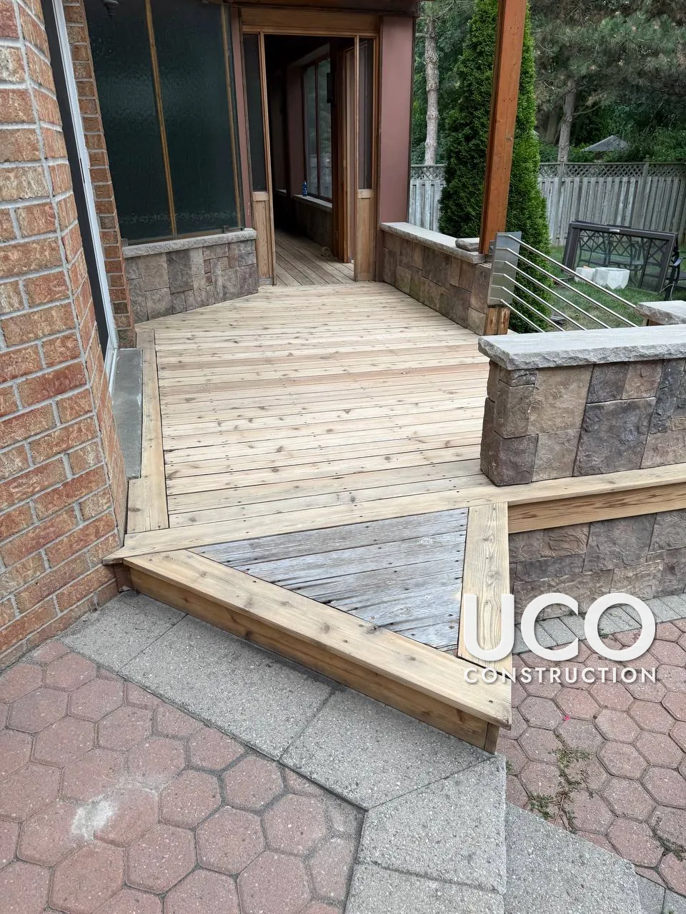 Cedar Deck and Sunroom Floor Restoration in Whitby: Weathered Cedar Boards Replaced Where Needed, Sanded and Stained Under a Pergola