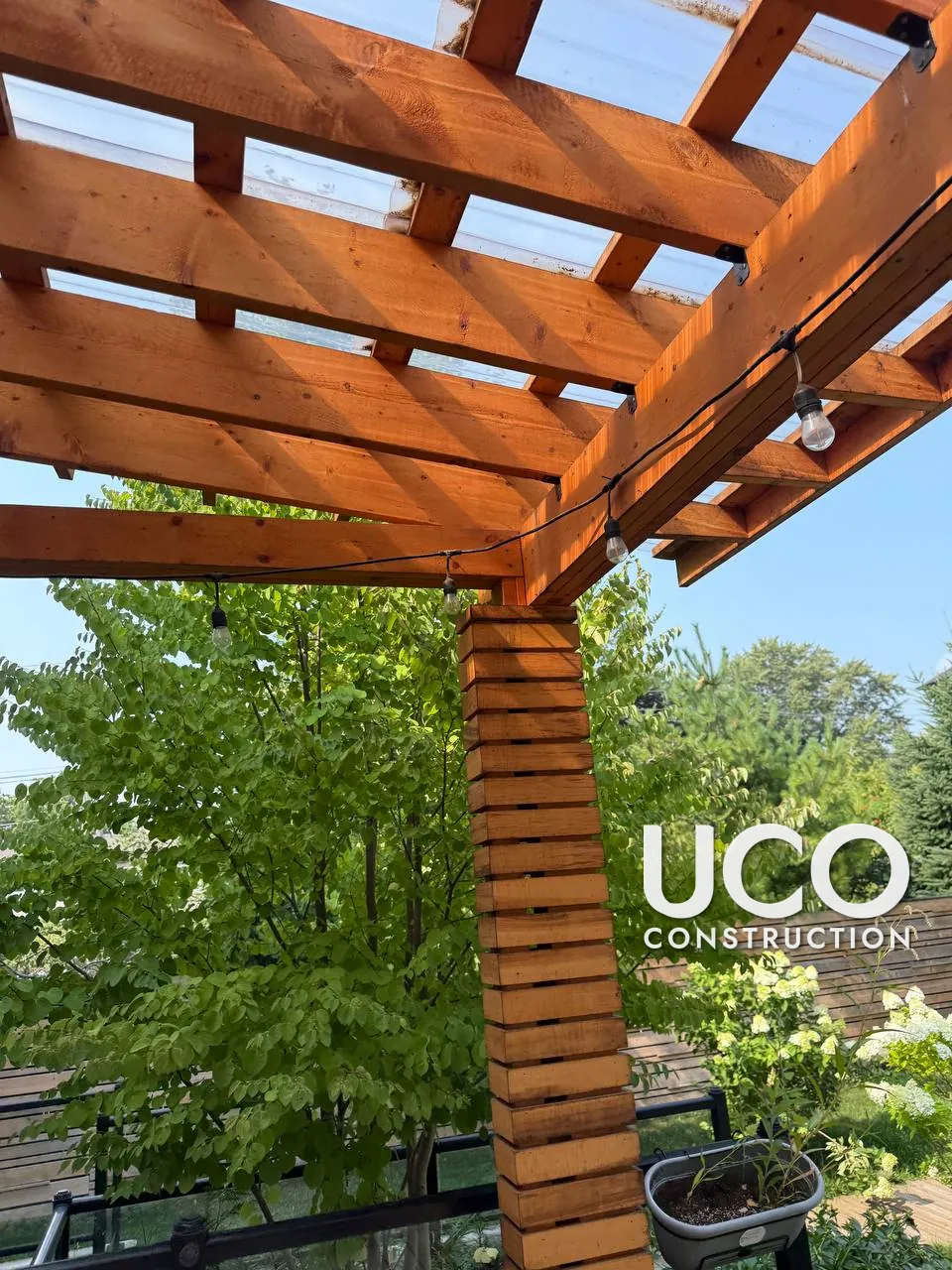 Pergola and Deck Staining in Oakville: Large Wood Pergola, Slatted Columns and Deck With Glass Railings Sanded and Refinished in a Natural Stain