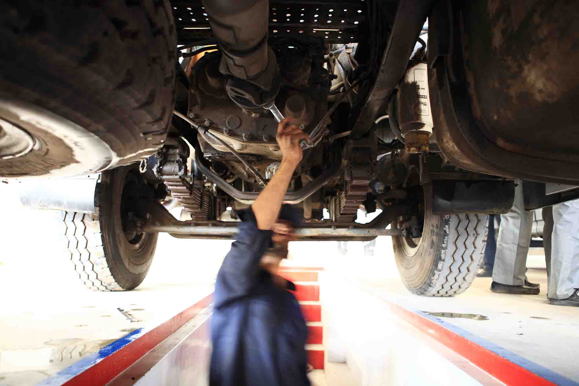LEVRAM Heavy Diesel Mechanic in Melbourne repairing a truck under the body