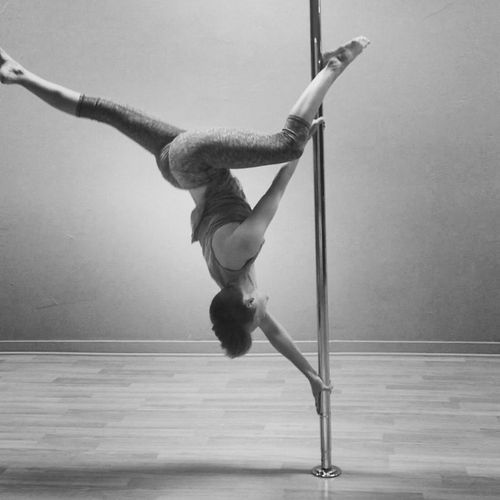 pole dancer in butterfly move