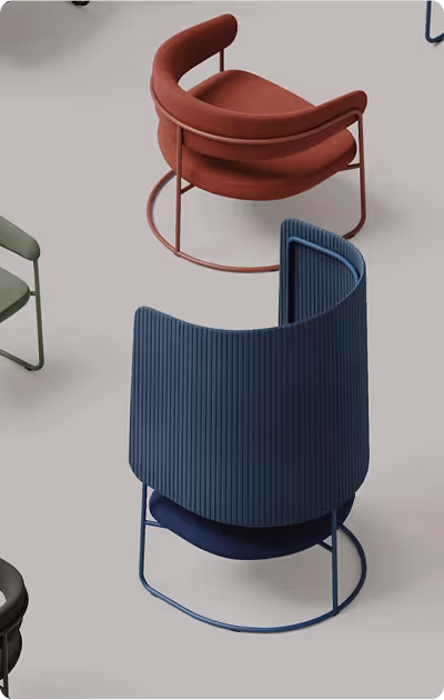 Modern curved lounge chairs in red and blue with metal frames on a light floor.