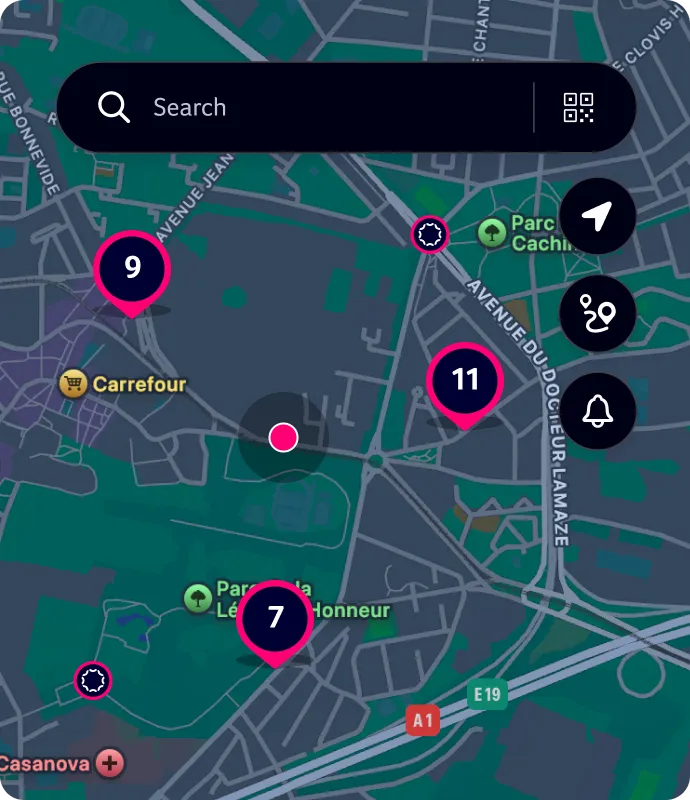 Map interface showing locations marked with pink pins labeled 7, 9, and 11 near Parc de la Légion d'Honneur and Carrefour supermarket, with search bar and navigation icons.