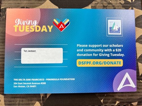 Back of the 2023 Giving Tuesday Postcard with stamp and label