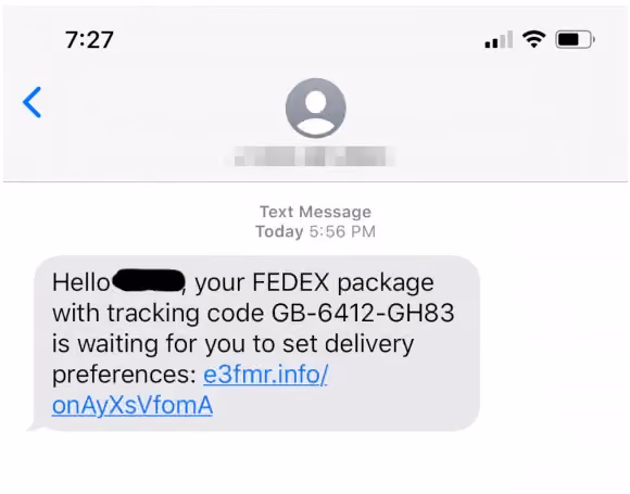 iPhone screenshot of a text message claiming a FedEx package is awaiting delivery preferences, including a suspicious shortened link.