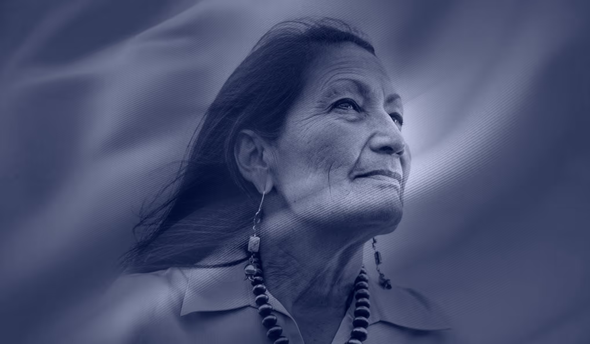 A woman with a necklace on her neck.