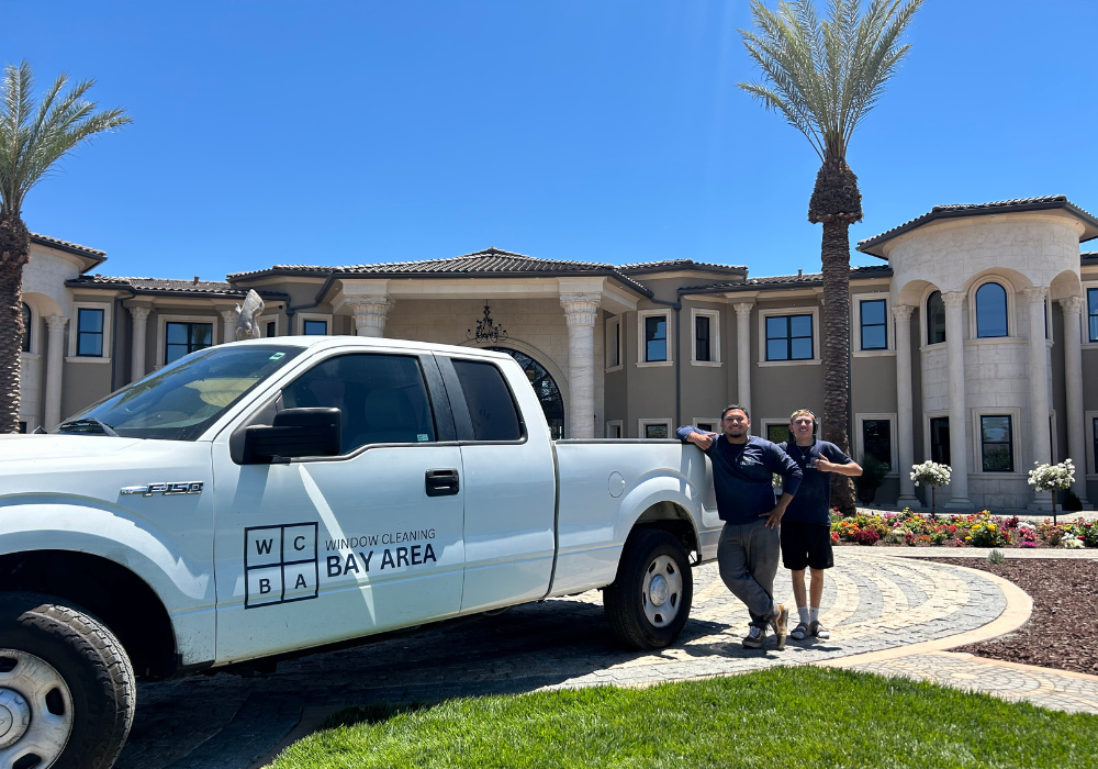 window cleaner cleaning a luxury homes windows