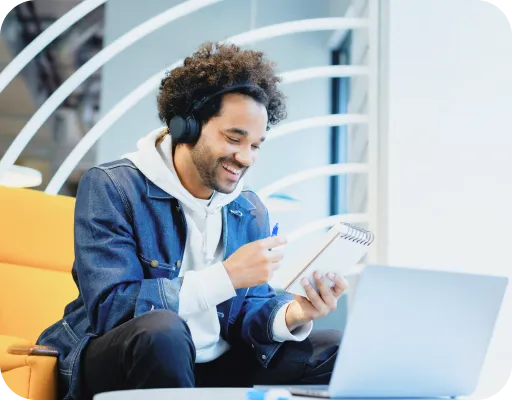 Young man with headphones looking at mobile device