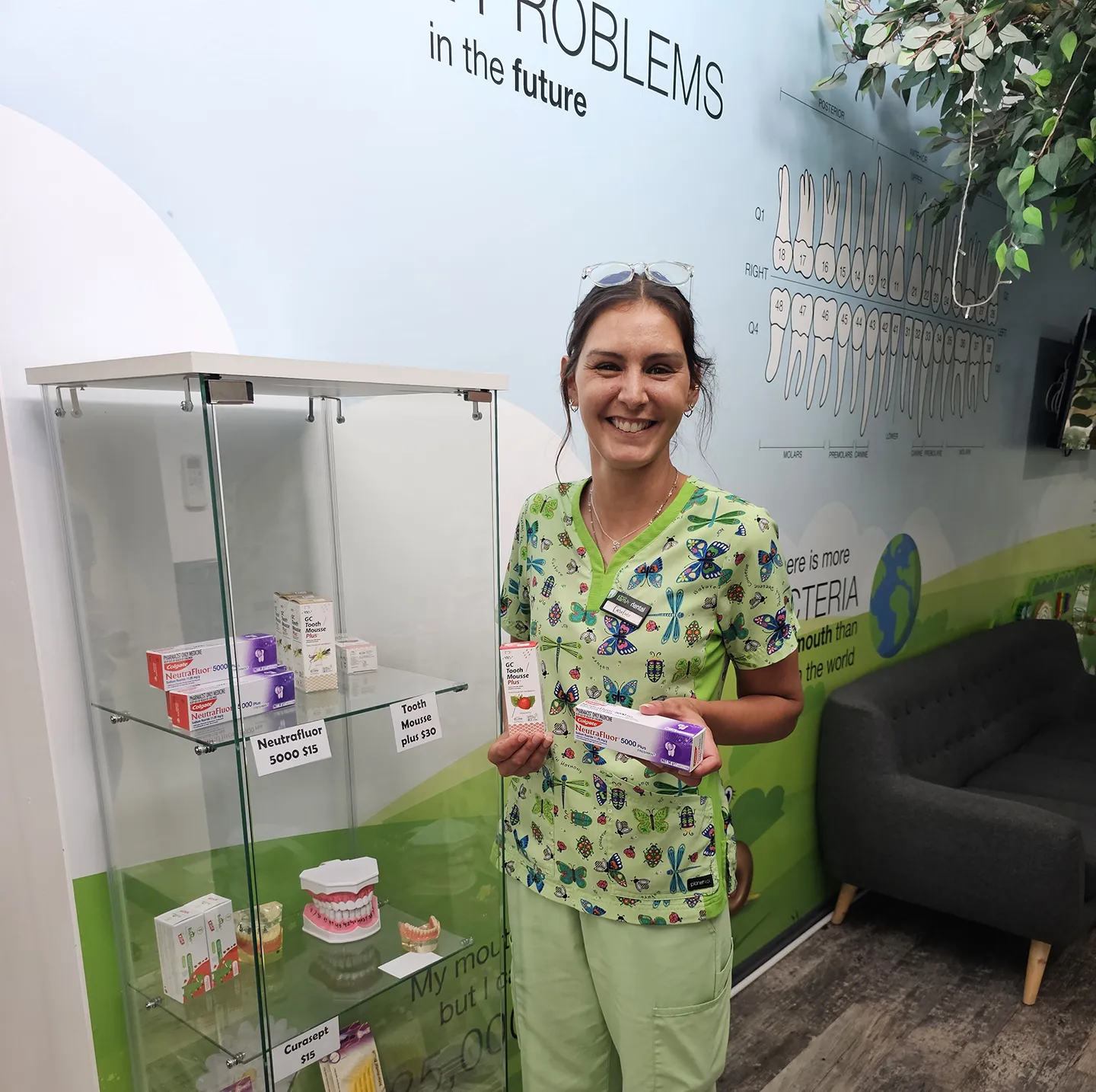 Dental nurse holding products