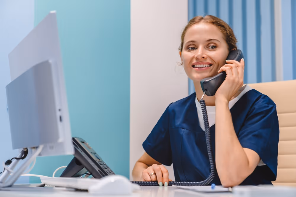 Dental receptionist taking a call