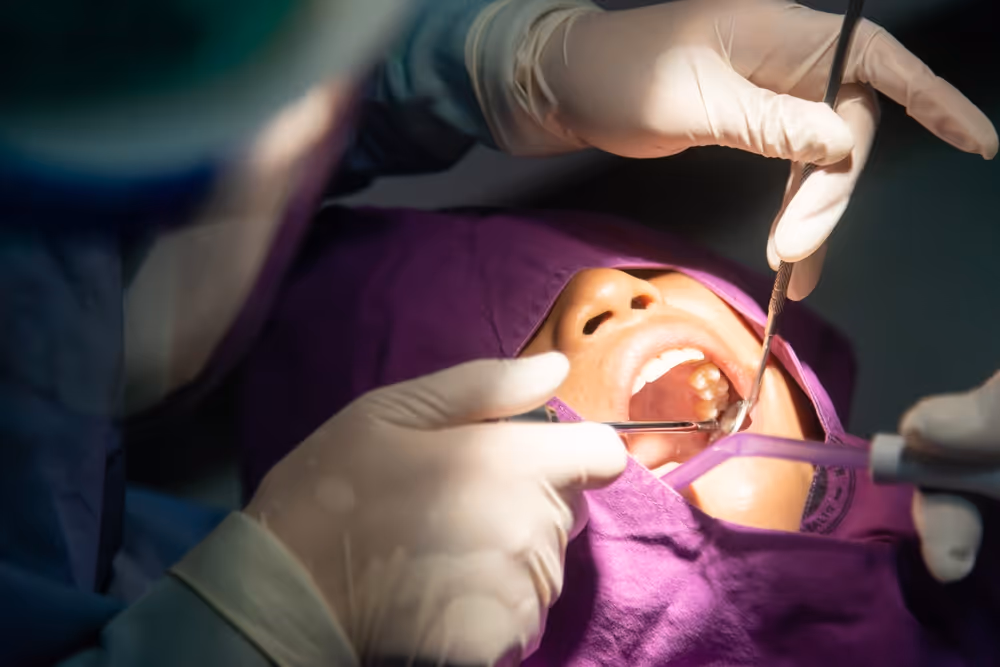 A patient getting teeth inspected by dentist