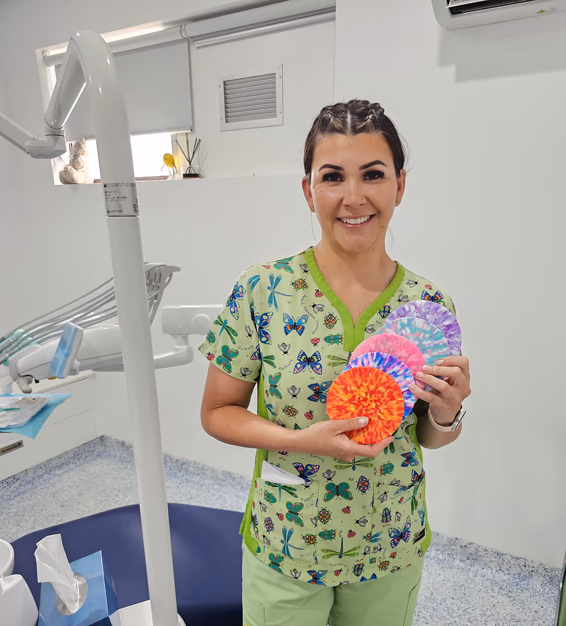 Dental nurse holding colour patterns