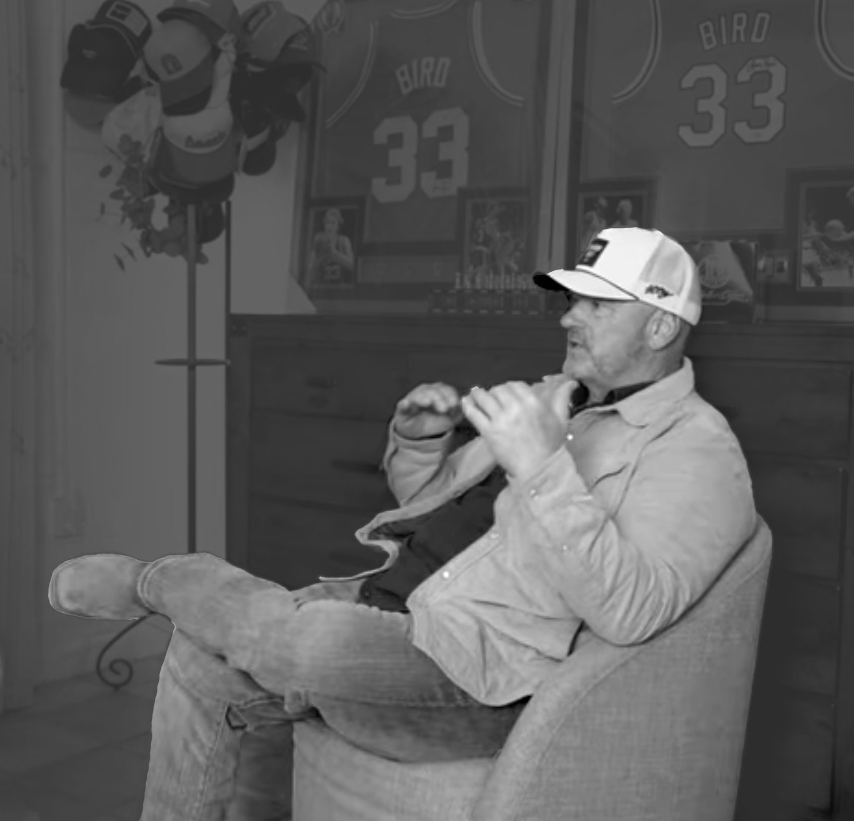 Picture of Trevor sitting in a charge and discussing.