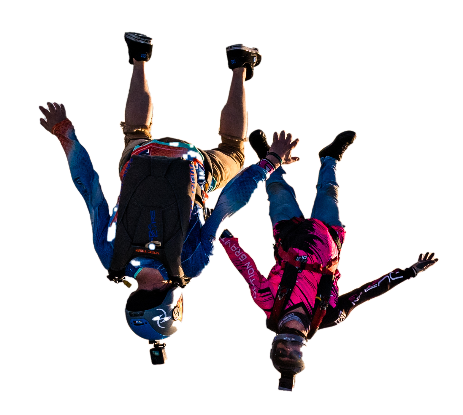 Two skydivers flying together, cut out