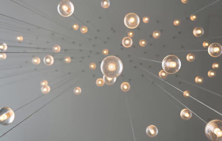 Multiple lightbulbs on a string hanging from the ceiling