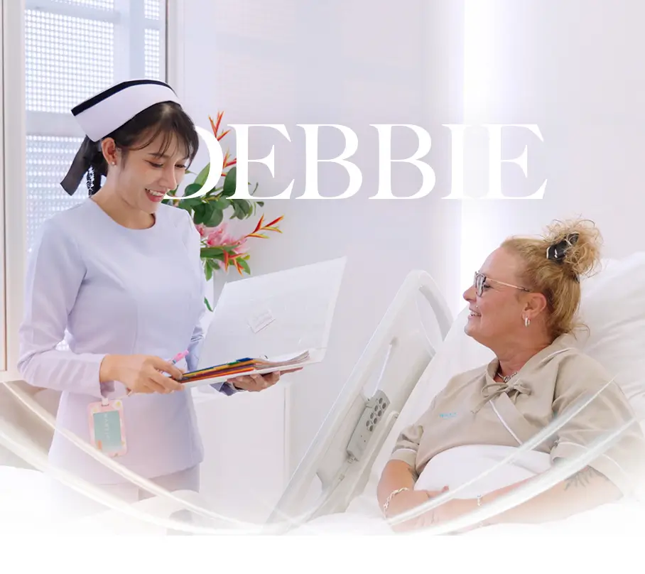 Smiling Nurse checking on patient.