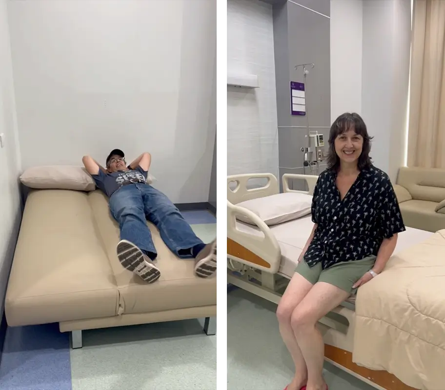 Christine and her husband in their private hospital room before surgery, relaxing on the patient bed and companion bed.