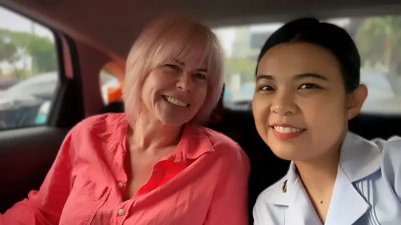 Susie with Nurse Fah on the way to the hospital in Bangkok