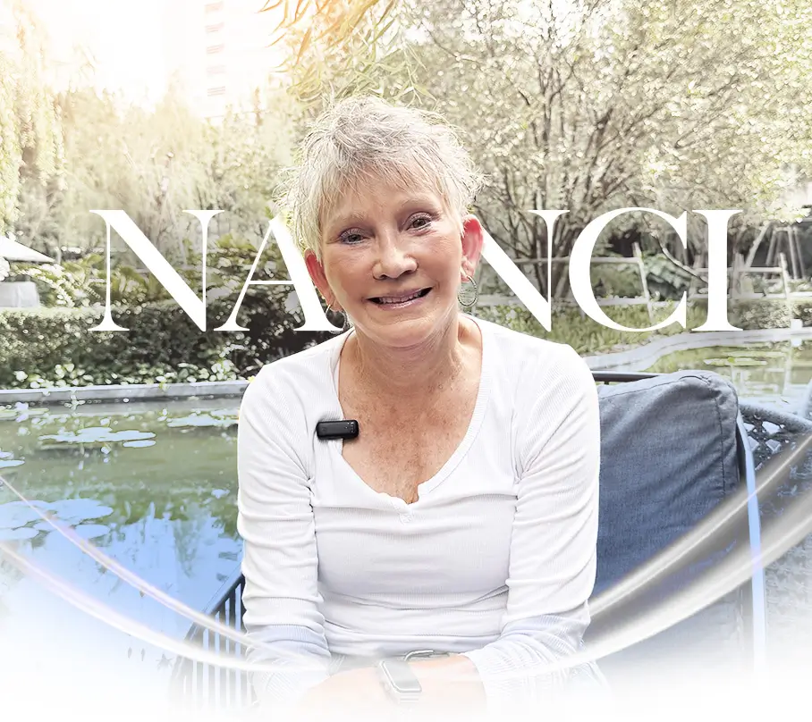 Nanci in Bangkok after surgery, smiling during recovery