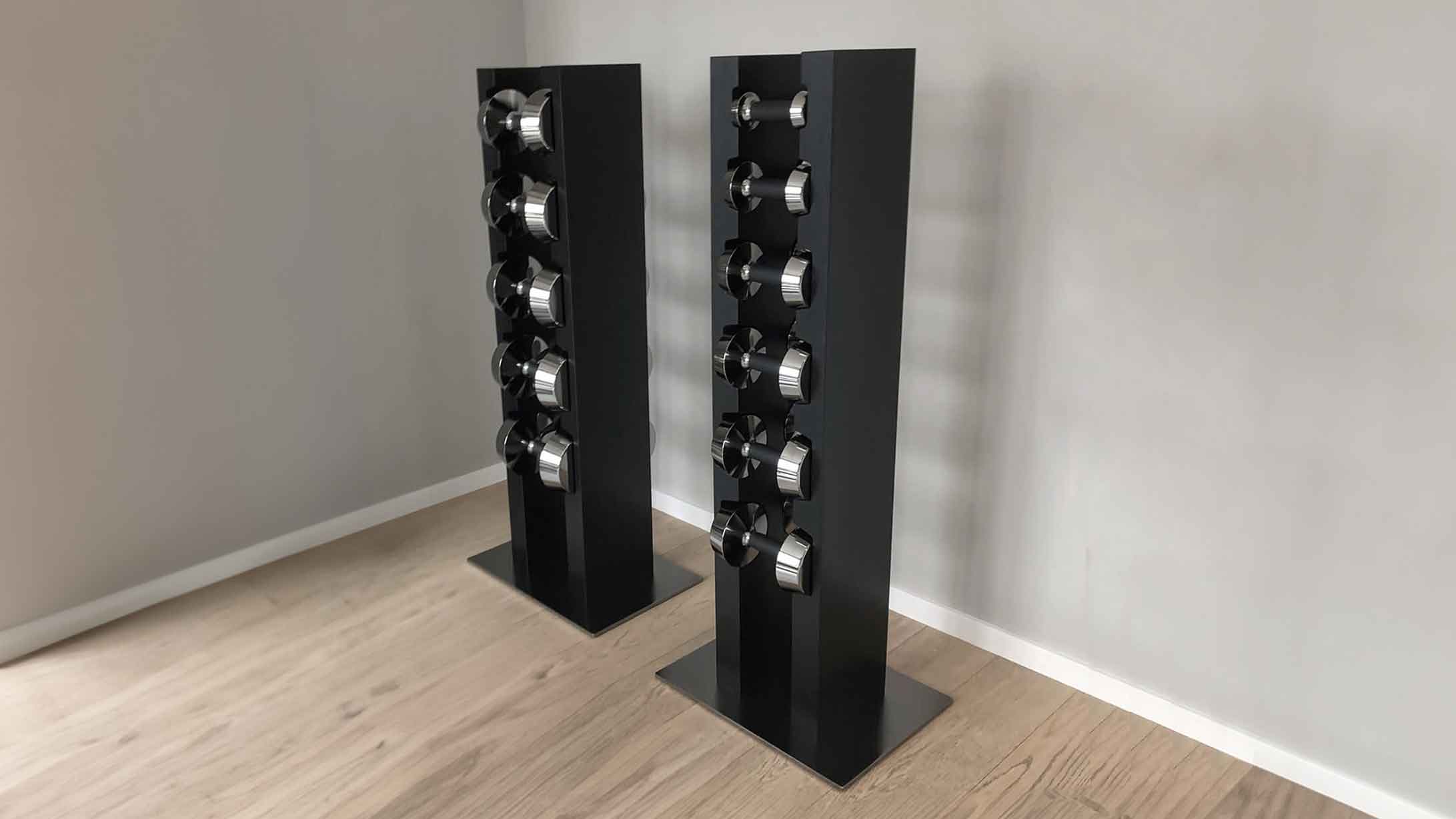Illustration of the dumbbell rack made of dark oak wood and a stainless steel base plate to hold the high-quality designer dumbbells to match your home furnishings.