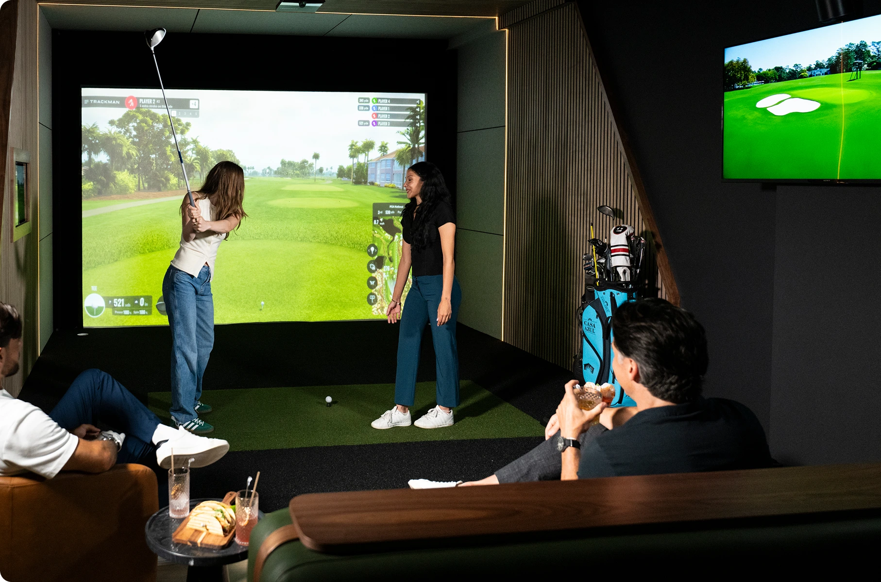 Teammates Enjoying a Team Night at the Tips Golf Brickell Miami