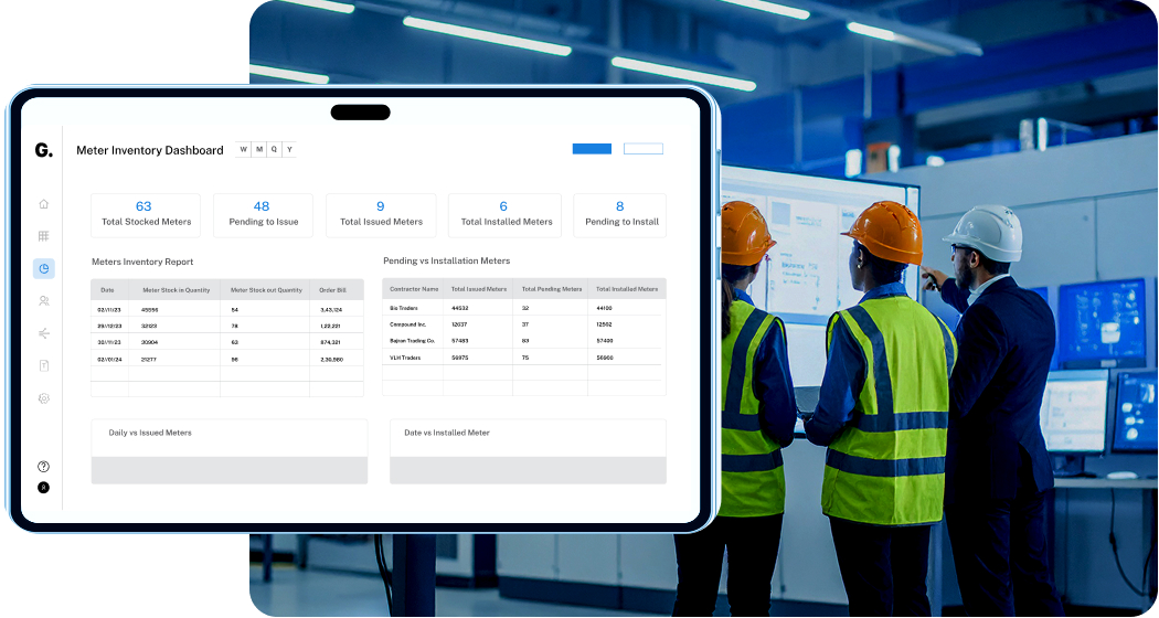 Three workers wearing safety helmets and reflective vests look at a large digital meter inventory dashboard in an industrial setting.
