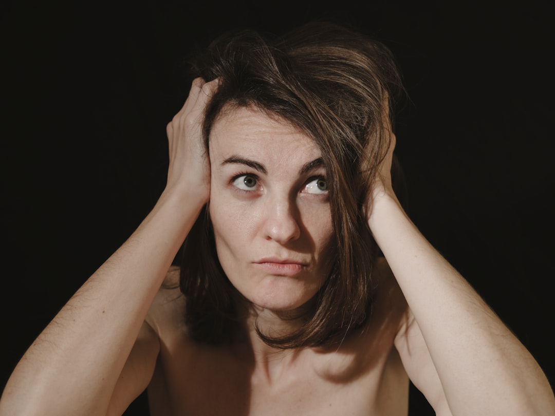 An image of a person looking unwell, holding their head to indicate a headache, with a slightly confused or dazed expression - carbon monoxide leak An image of a person looking unwell, holding their head to indicate a headache, with a slightly confused or dazed expression - carbon monoxide leak