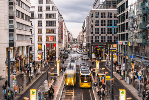 BGI team energetically celebrating at an event, with everyone jumping and smiling in a display of joy and camaraderie