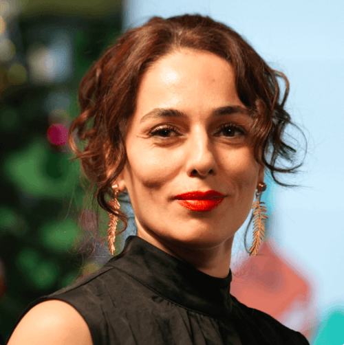 BGI team energetically celebrating at an event, with everyone jumping and smiling in a display of joy and camaraderie