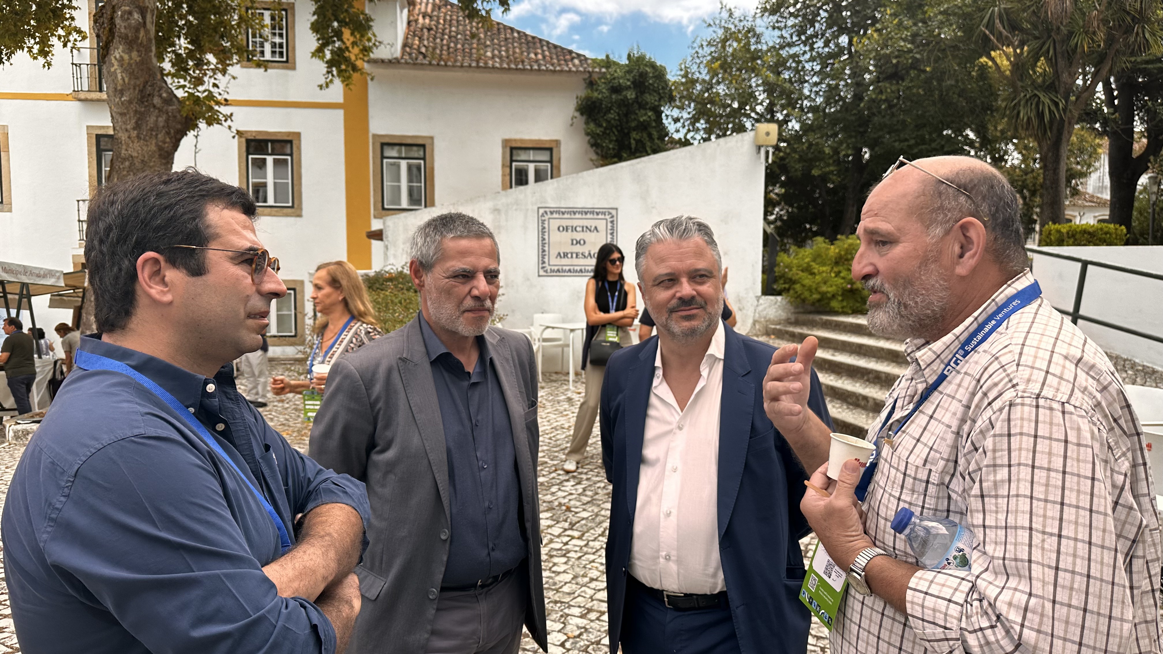 BGI team energetically celebrating at an event, with everyone jumping and smiling in a display of joy and camaraderie