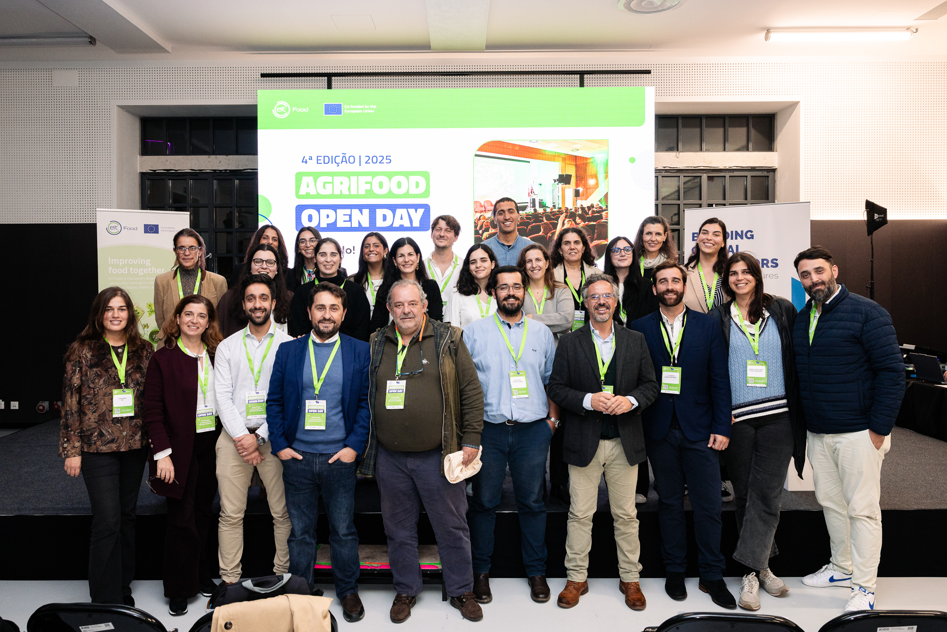 BGI team energetically celebrating at an event, with everyone jumping and smiling in a display of joy and camaraderie