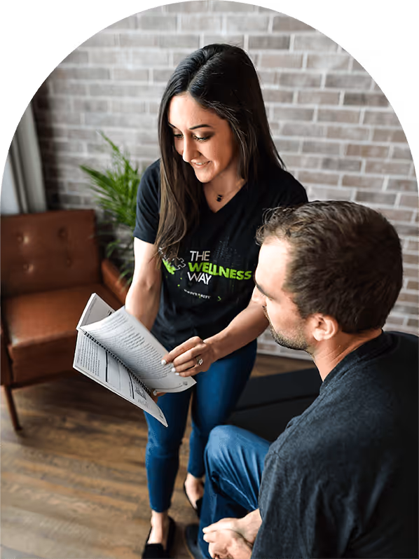 dr jenny going through a printed guide with a patient