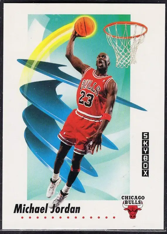 Basketball card showing Michael Jordan in Chicago Bulls uniform mid-air dunking a basketball with a glowing trail, with Skybox logo and Bulls emblem.