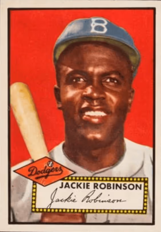 Baseball card featuring Jackie Robinson in a Brooklyn Dodgers uniform holding a bat, with his name and signature at the bottom.