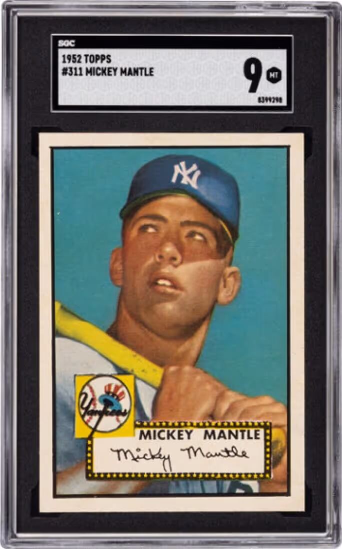 1952 Topps #311 Mickey Mantle baseball card showing Mantle in a New York Yankees cap holding a bat, graded 9 near mint by SGC.