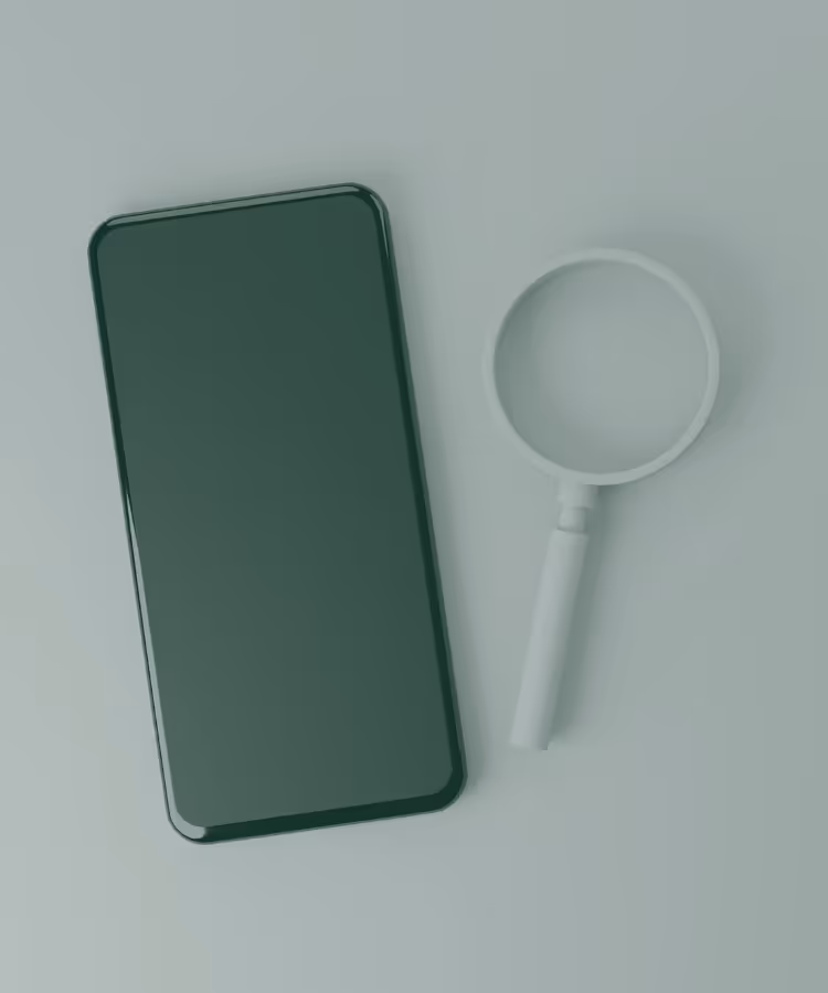 A cellphone and a scope on a white table, representing the dedication of Juillet Marketing in  providing SEO as a service.