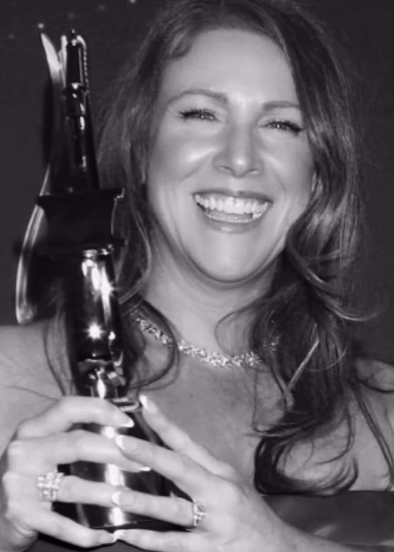 Voiceling Melissa Mirren holding her Voice Arts Award trophy.