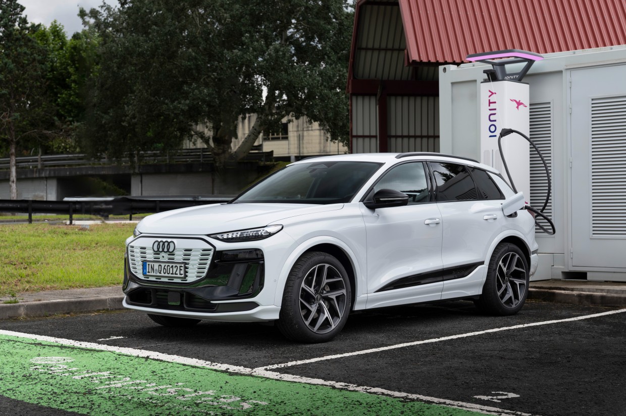 White Audi Q6 e-tron charging at an IONITY station