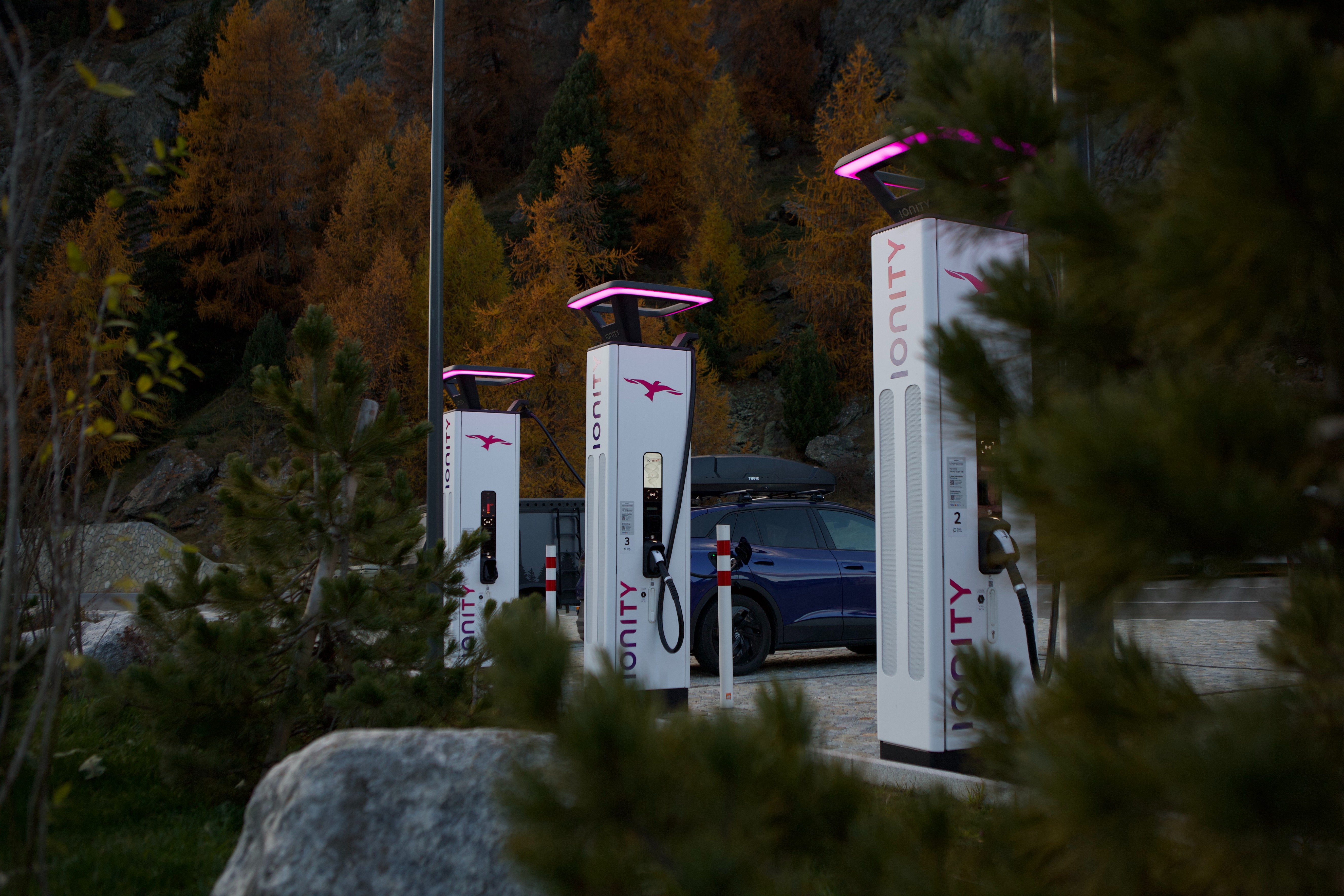 IONITY charging stations with an autumn landscape in the background