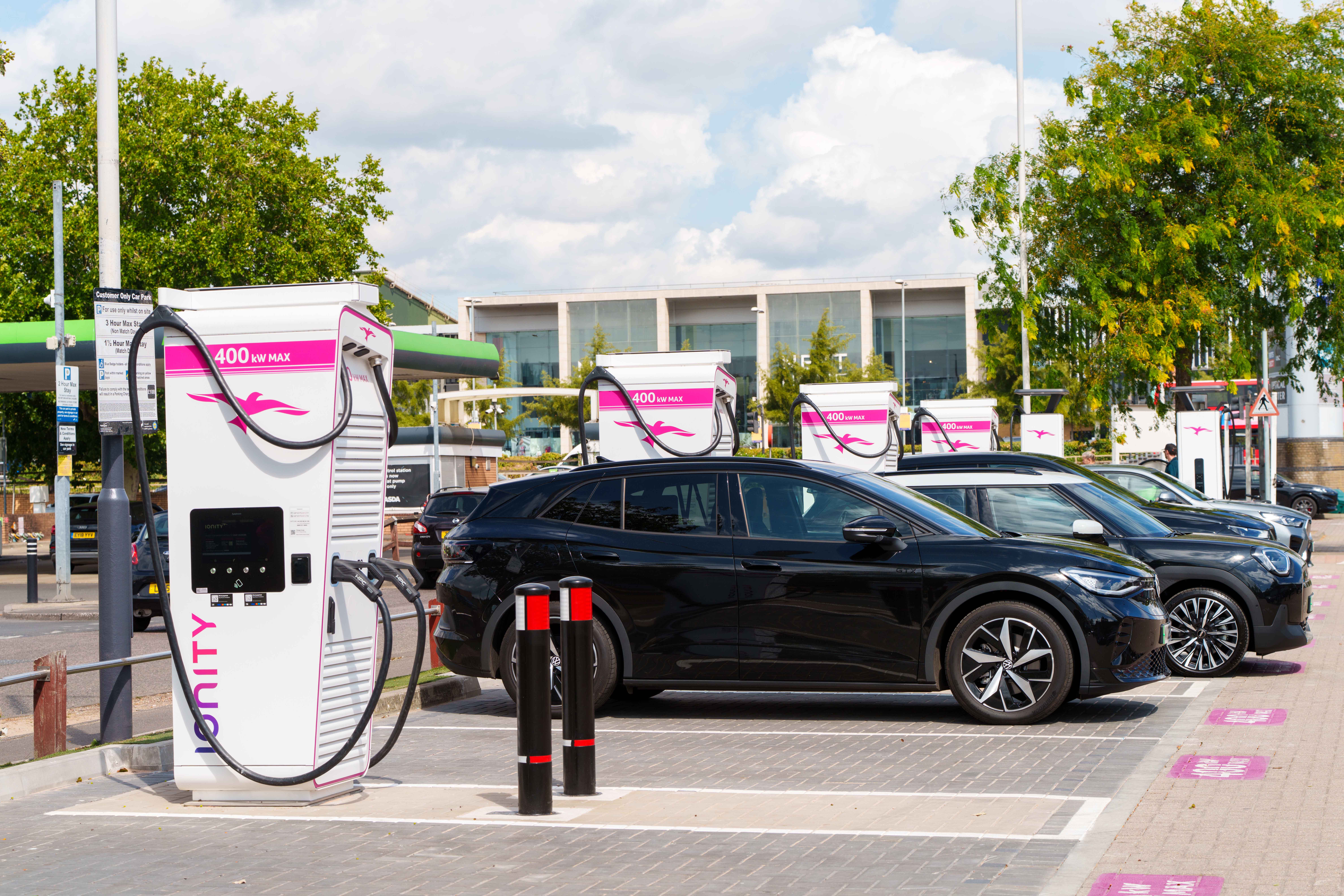 A row of electric cars charging at IONITY's newest ultra-fast charging location in Greenwich, London